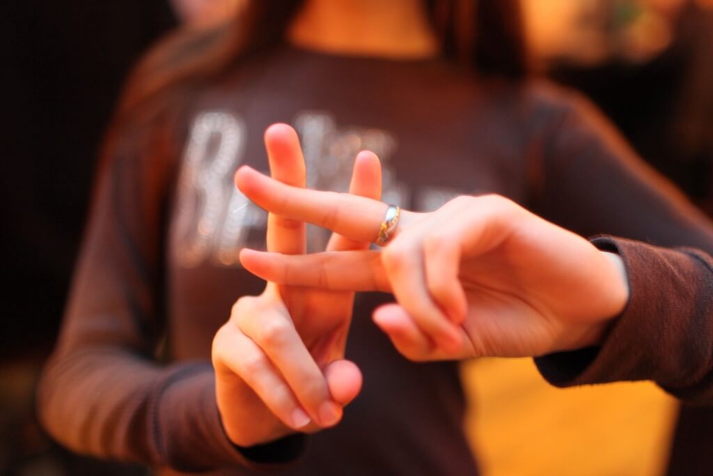 Girl doing peace sign