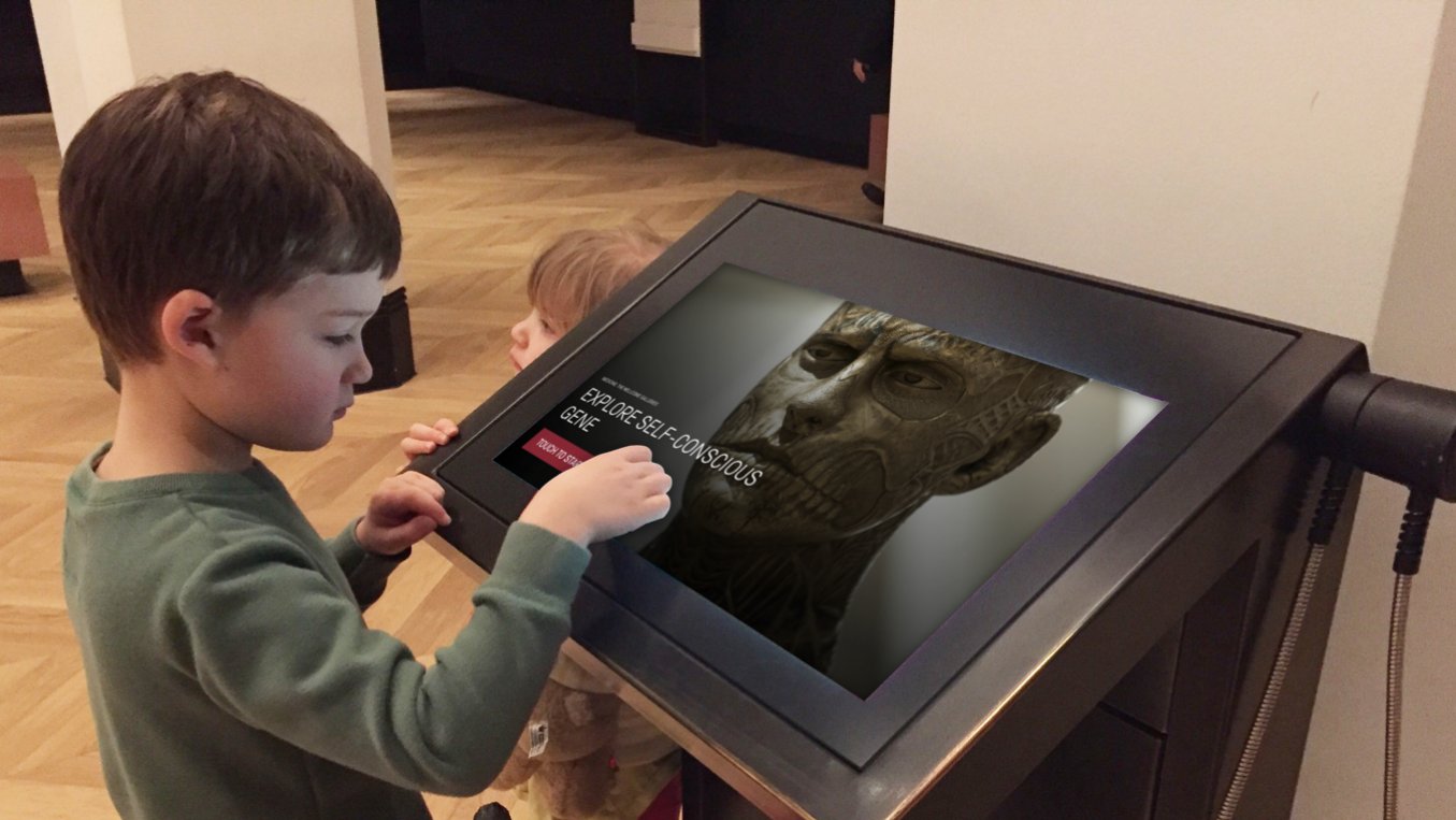 A child playing on the museum kiosk